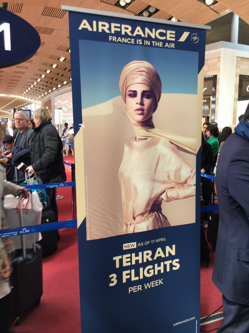 آگهی پرواز تهران و پاریس با تصویر زنی با حجاب (تصویر)