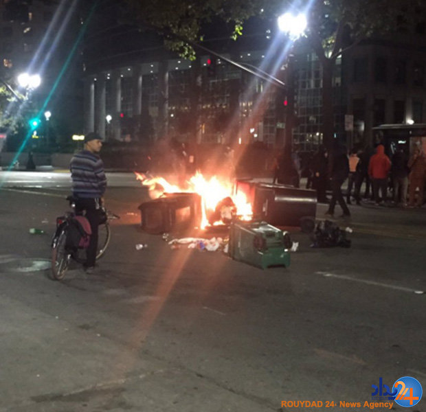 طرفداران کلینتون پرچم آمریکا را آتش زدند