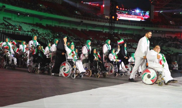 رژه ورزشکاران ایرانی در قالب کاروان خودباوری و امید با پرچمداری ساره جوانمردی +عکس
