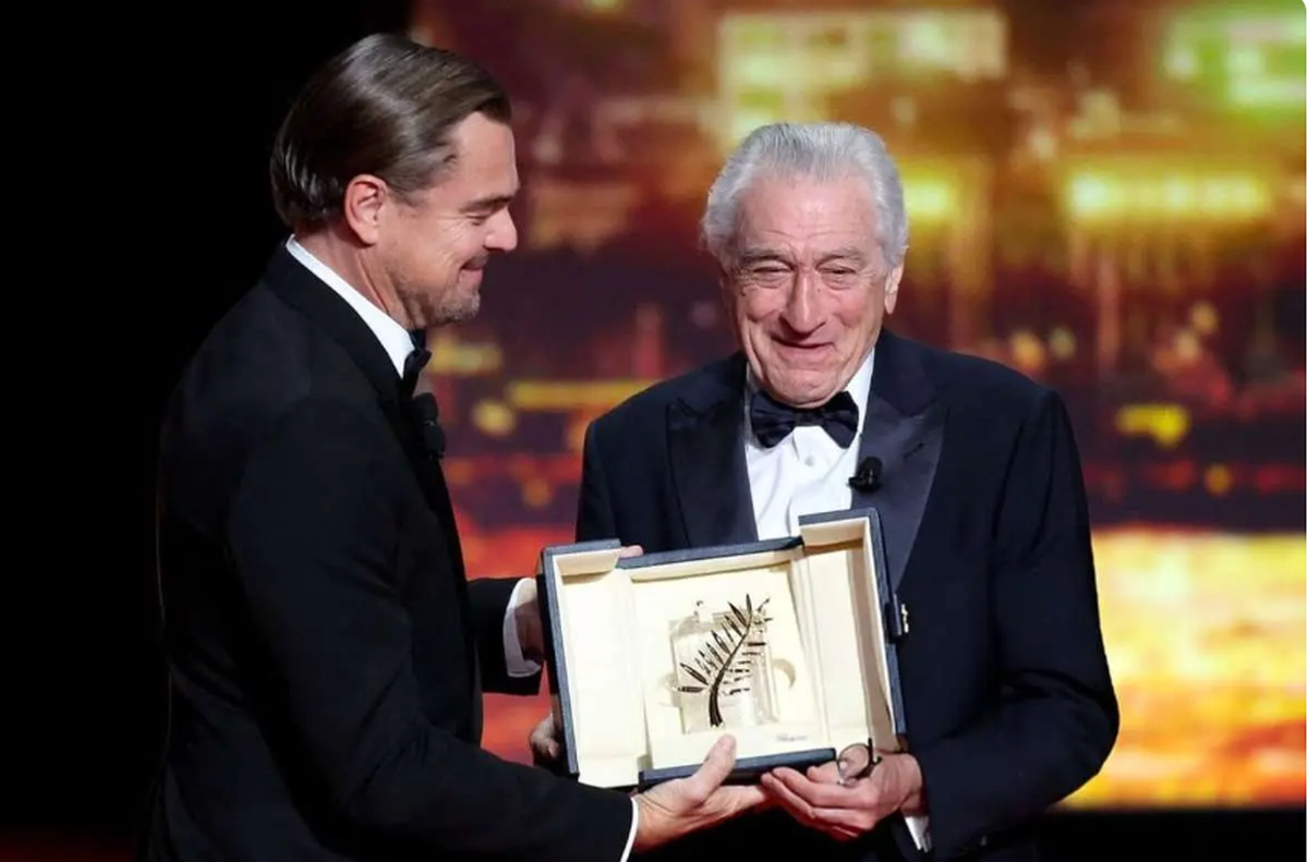 ببینید| لحظه اهدای نخل طلای کن به دنیرو توسط دی‌کاپریو