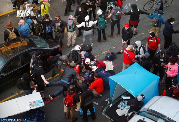 حمله با خودرو به معترضان