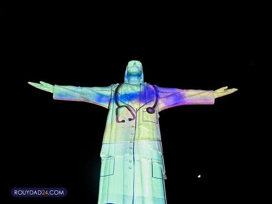 تصاویری از کادر درمان بر مجسمه مسیح