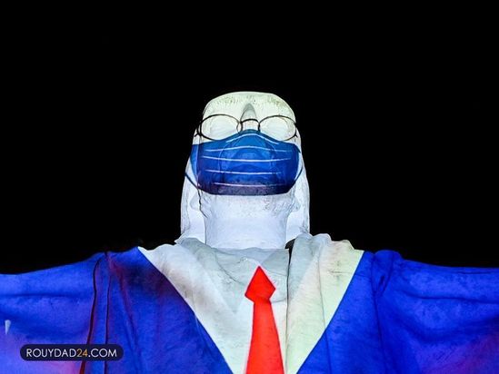 تصاویری از کادر درمان بر مجسمه مسیح