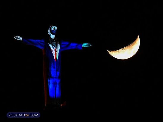 تصاویری از کادر درمان بر مجسمه مسیح