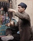 عکسی از نمایش خیمه شب بازی در دوران قاجار